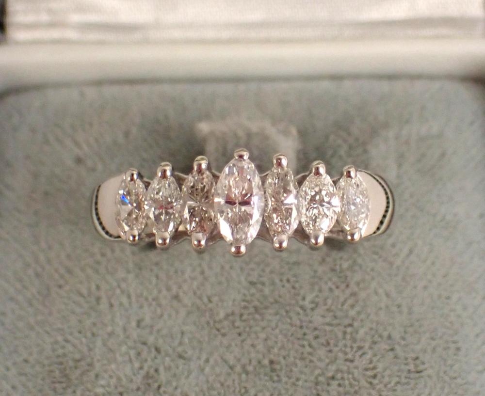 Appraisal: DIAMOND AND FOURTEEN KARAT GOLD RING with a row of