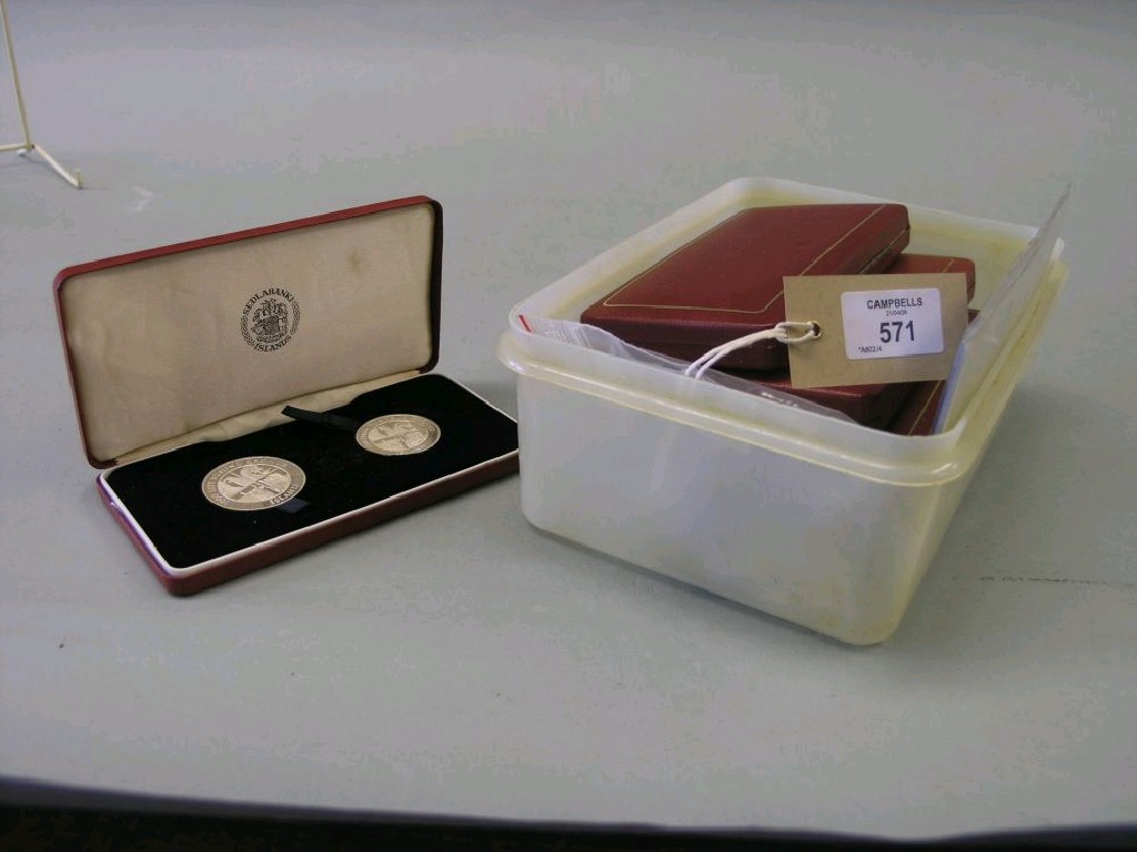 Appraisal: Five cased Royal Mint silver coin sets each case containing