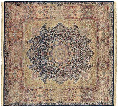 Appraisal: Kirman rug elaborate central medallion on dark blue ground corner