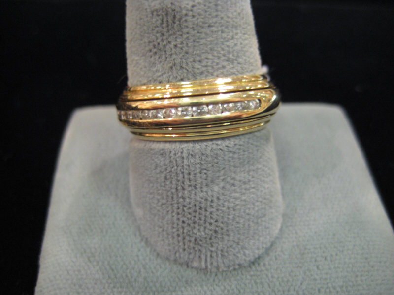 Appraisal: DIAMOND WEDDING BAND k yellow gold wedding band with moveable