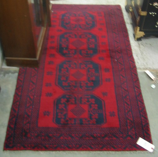 Appraisal: TWO PAKISTANI BELOUCH AREA RUGS hand knotted both geometric in