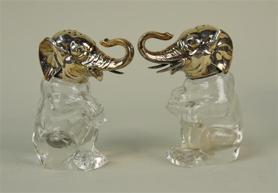 Appraisal: PAIR OF GERMAN SILVER AND GLASS ELEPHANT FORM SHAKERS height