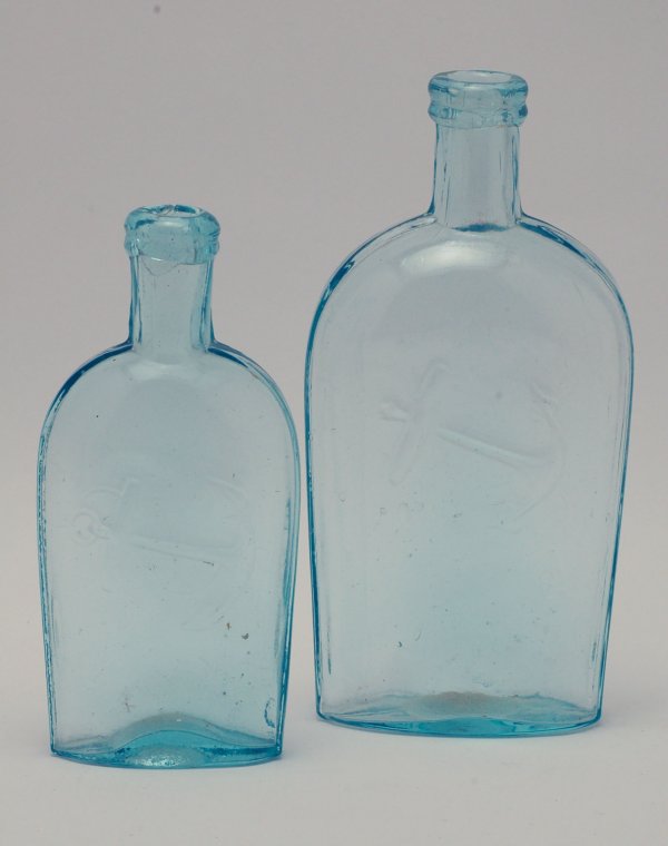 Appraisal: Two Baltimore Glass Works light aqua flasks molded with applied