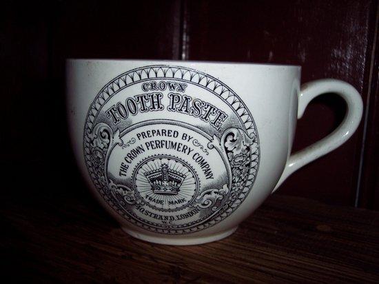 Appraisal: A large Portmeirion tea cup advertising Crown toothpaste cm high