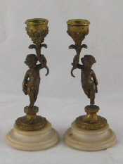 Appraisal: A pair of bronze ormolu candlesticks in the form of