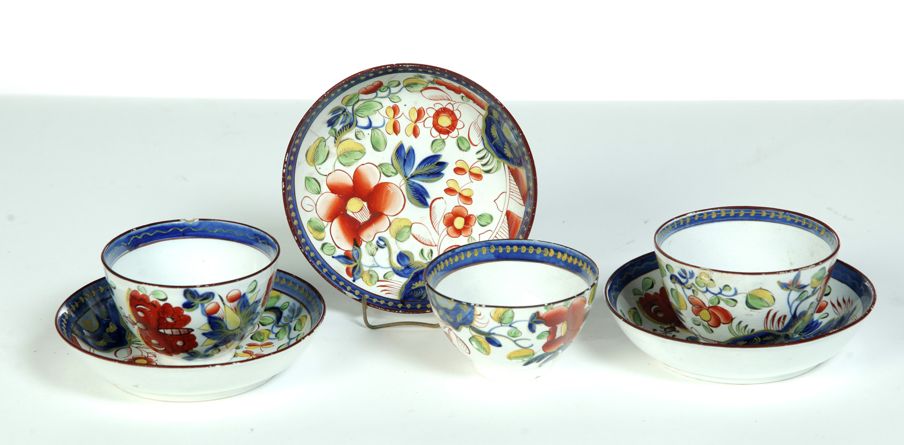 Appraisal: THREE GAUDY DUTCH HANDLESS CUPS AND SAUCERS England st quarter-