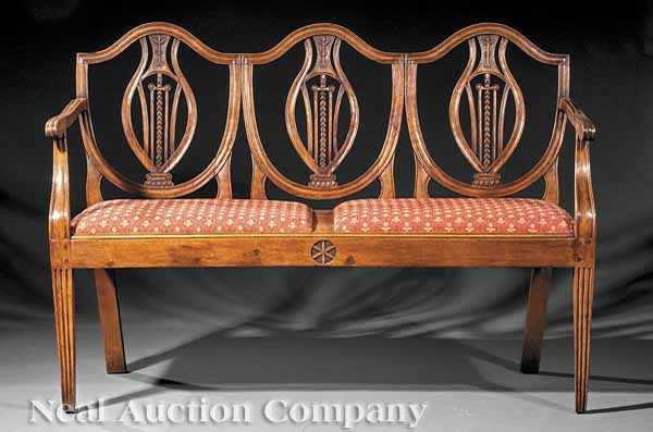 Appraisal: An Antique French Provincial Triple-Back Settee shield-shaped chair backs with