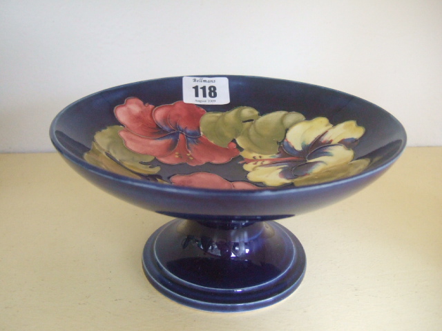 Appraisal: A Moorcroft pedestal bowl decorated with hibiscus against a cobalt