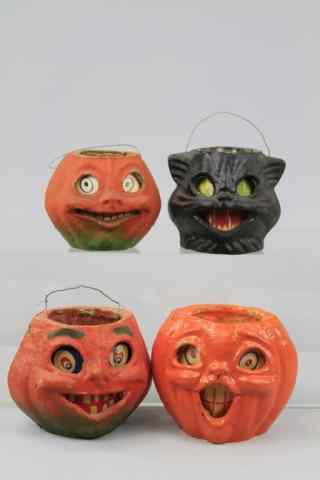 Appraisal: THREE PUMPKIN FACE LANTERNS AND BLACK CAT Three USA pulp