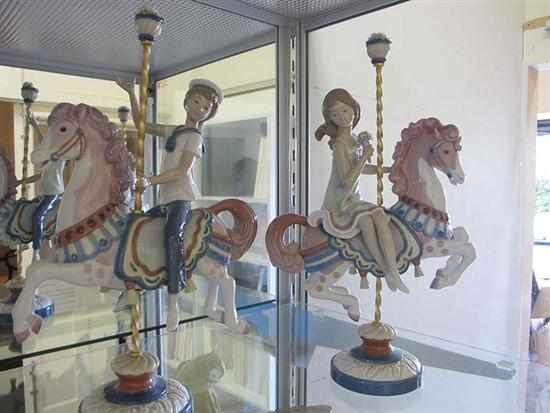 Appraisal: PAIR OF LLADRO CAROUSEL HORSE AND CHILD GROUPS