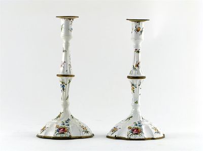 Appraisal: A pair of enamel candlesticks painted with colourful sprays of