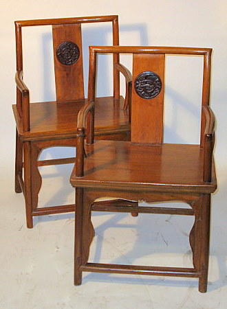 Appraisal: Pair Chinese elmwood elbow chairs Qing dynasty Square crestrail over