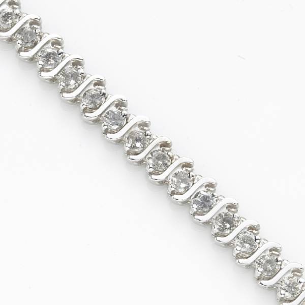 Appraisal: A diamond and fourteen karat white gold line bracelet estimated