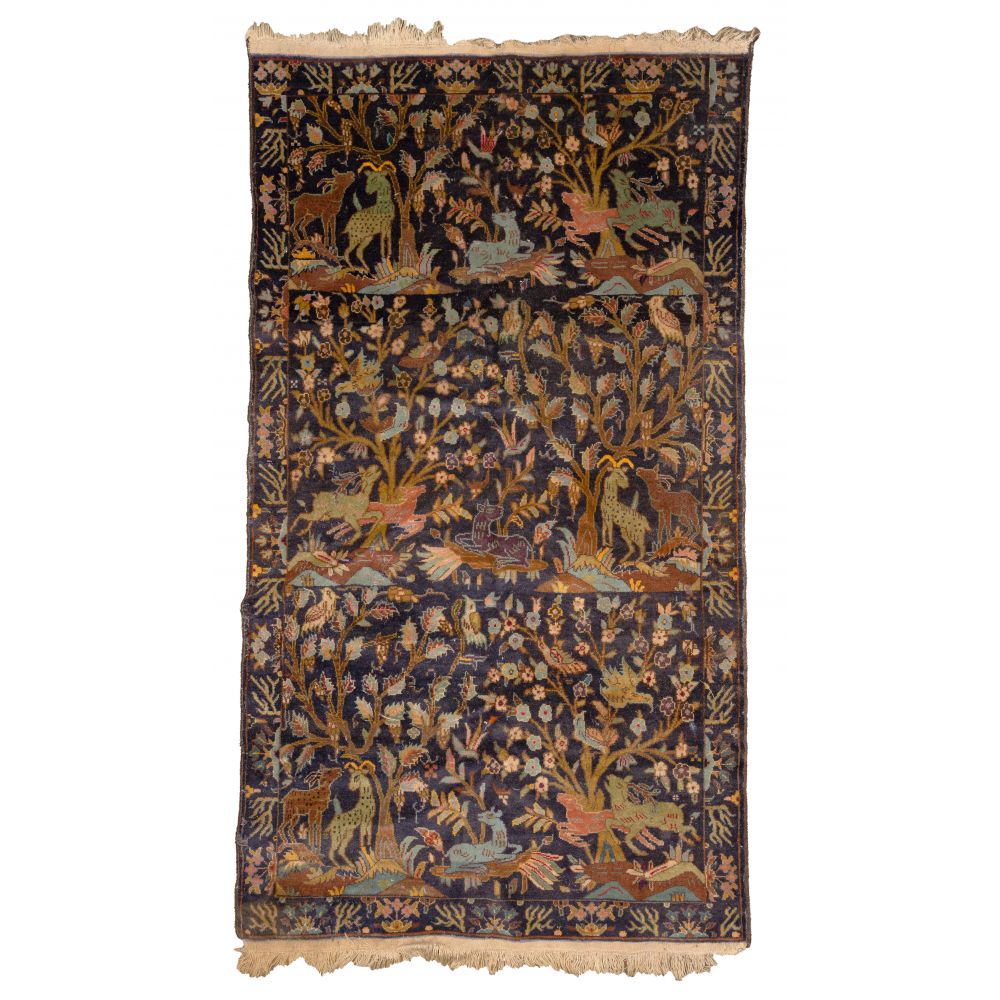 Appraisal: PERSIAN WOOL RUGHand woven depicting an animal motif with deer