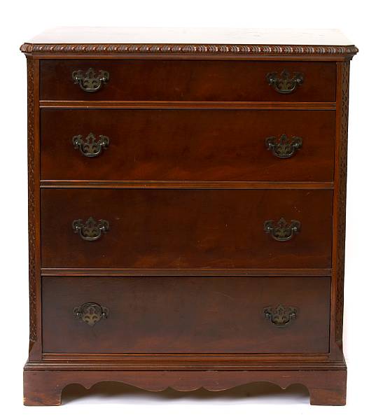 Appraisal: A George III style mahogany chest of four long drawers