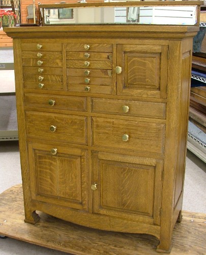 Appraisal: AN OAK DENTAL CABINET American early th century the front