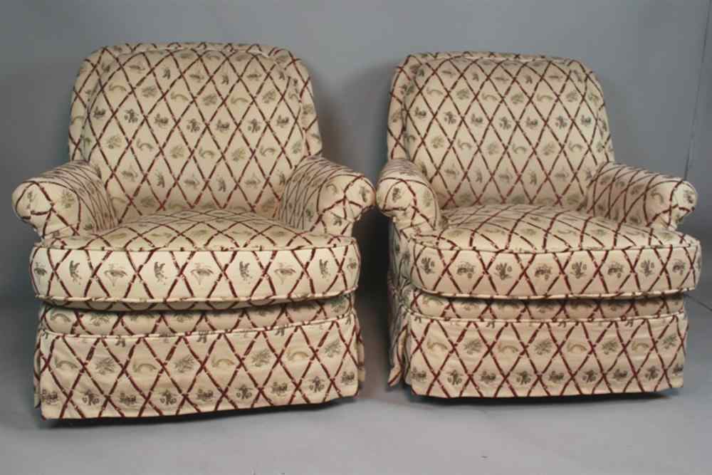 Appraisal: TWO UPHOLSTERED CLUB SWIVEL ROCKING CHAIRS Having cream ground with