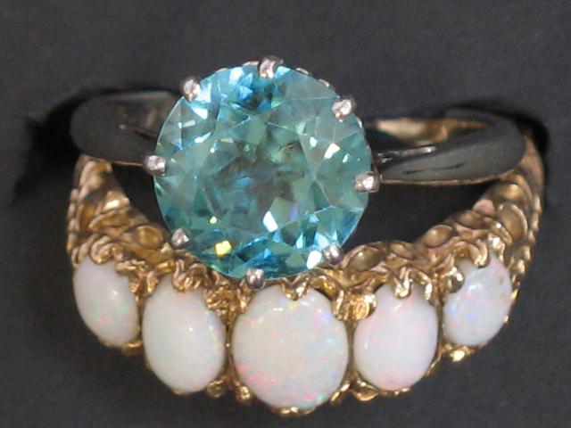 Appraisal: A VICTORIAN OPAL DRESS RING set with five oval graduated