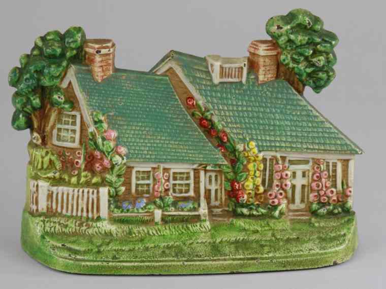 Appraisal: CAPE COD DOORSTOP Hubley depicts cottage w cheerful colored blue