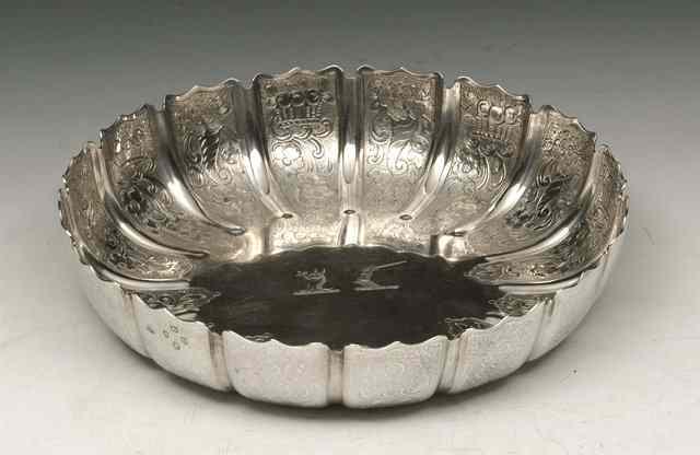 Appraisal: A VICTORIAN SILVER STRAWBERRY DISH with shaped edge and foliate