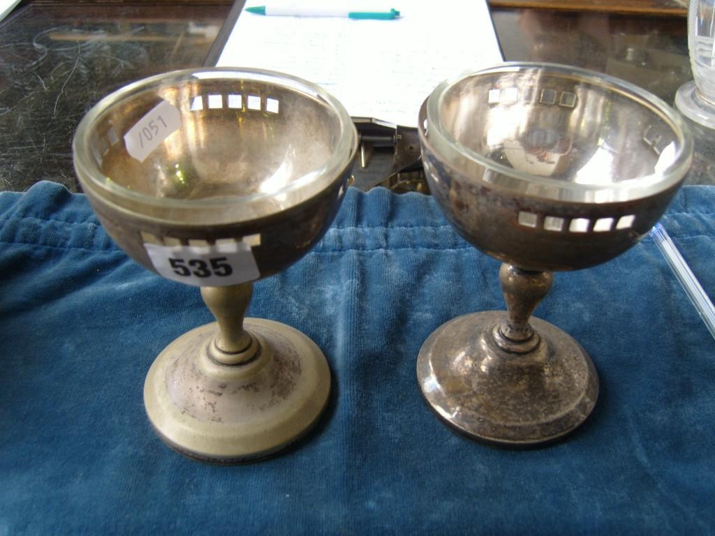 Appraisal: A pair of silver plated goblets with pierced decoration turned