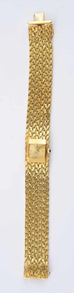 Appraisal: LADY'S K GOLD WRISTWATCH ROLEX Wide braided gold bracelet centering