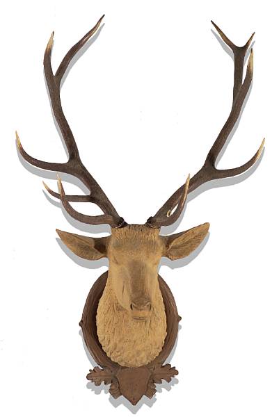 Appraisal: A Black Forest carved wood and natural horn mounted stag