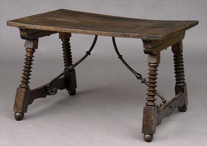 Appraisal: SPANISH TRESTLE TABLE The single board top raised on crisply