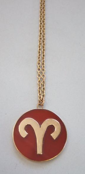 Appraisal: A circular cornelian pendant with a symbol of Aries motif