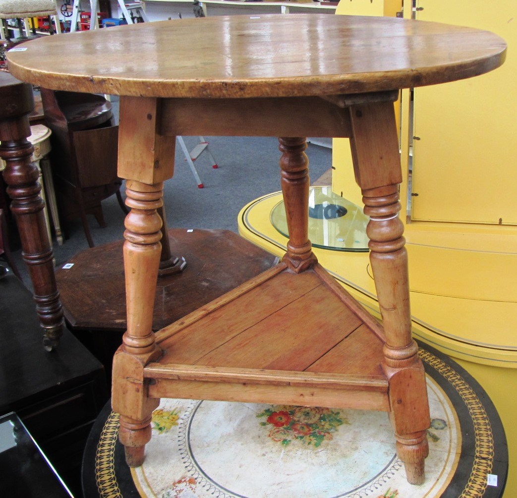 Appraisal: A th century pine cricket table on turned supports cm