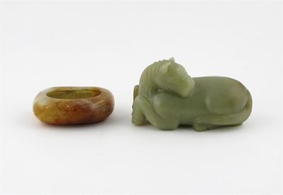 Appraisal: A Chinese jade carving of a horse recumbent with its