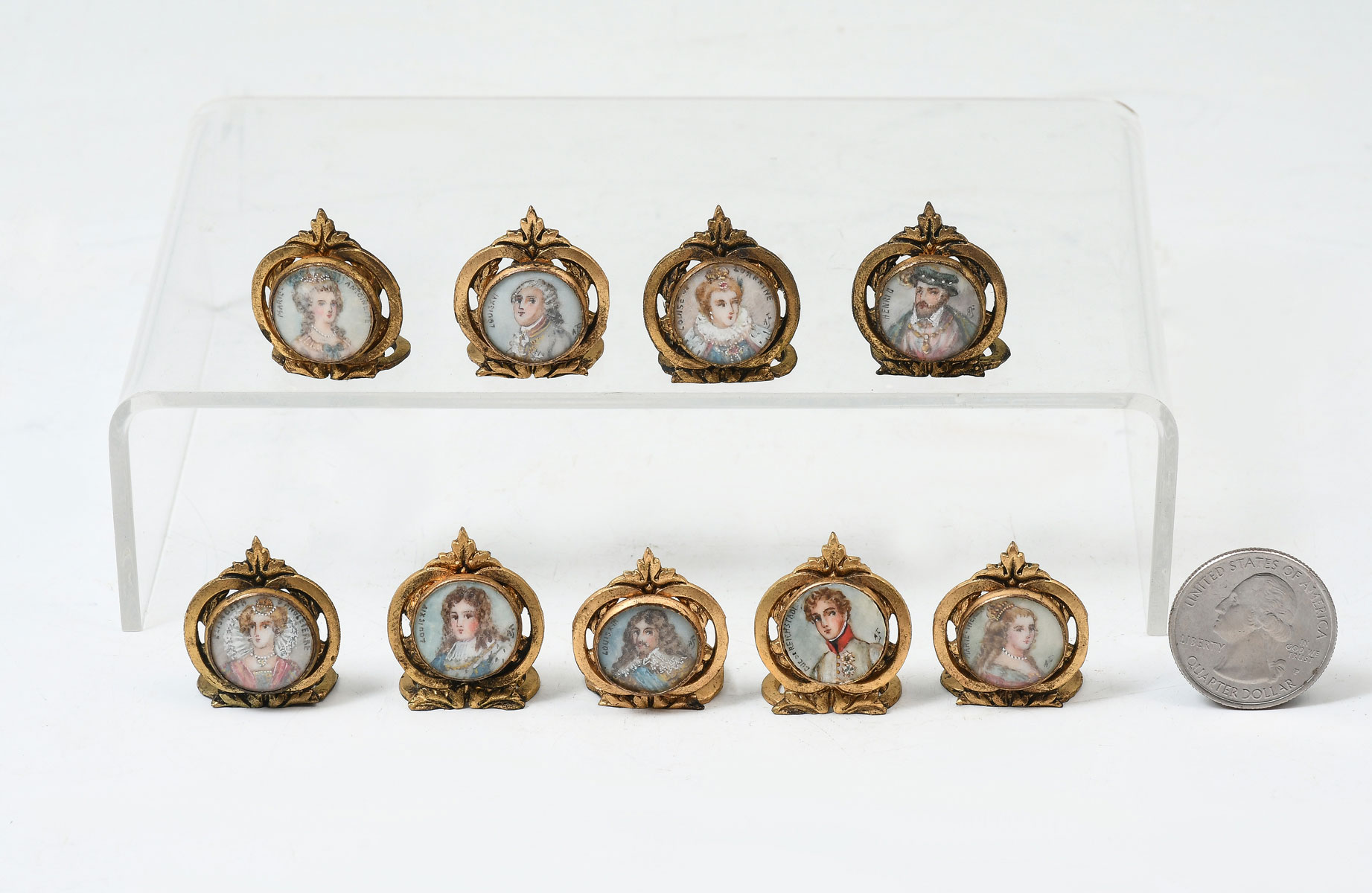 Appraisal: NINE PIECE GILT METAL FRAMED MINIATURE PLACECARD HOLDERS The portraits