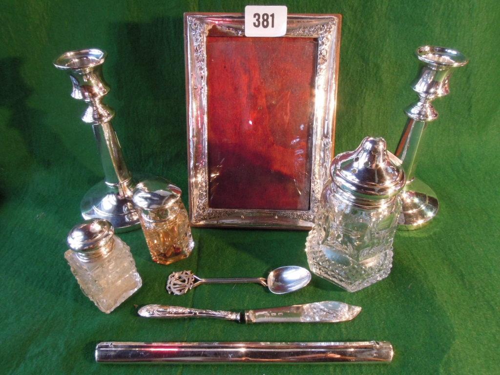 Appraisal: A mixed quantity of silver including two candlesticks a photo