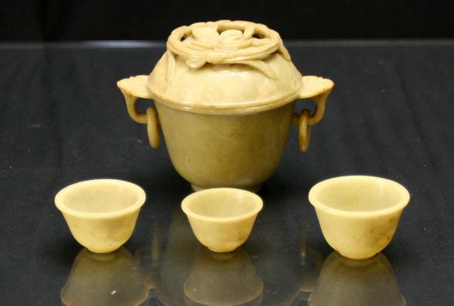 Appraisal: A Chinese twin handled hardstone offering cup with eight bowls