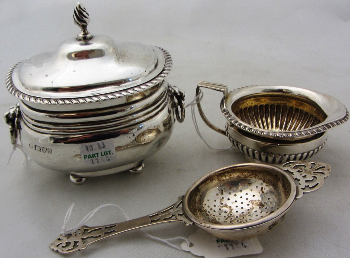 Appraisal: Silver comprising a hinge lidded tea caddy with lion mask