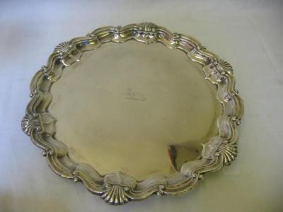 Appraisal: A SALVER of circular form the Chippendale border moulded with