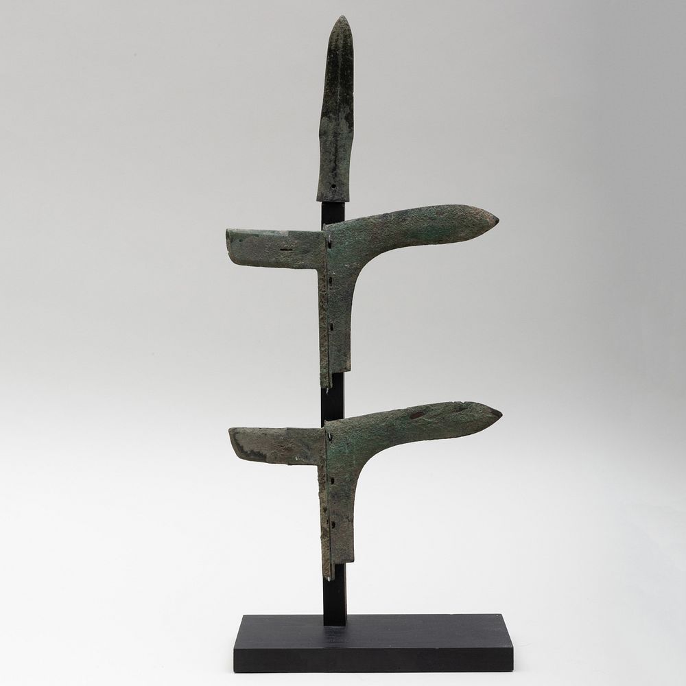 Appraisal: Chinese Bronze Dagger and Two Axe Heads Raised on stand