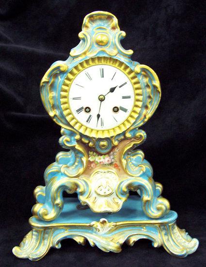 Appraisal: A mid th Century mantel clock and base of rococo