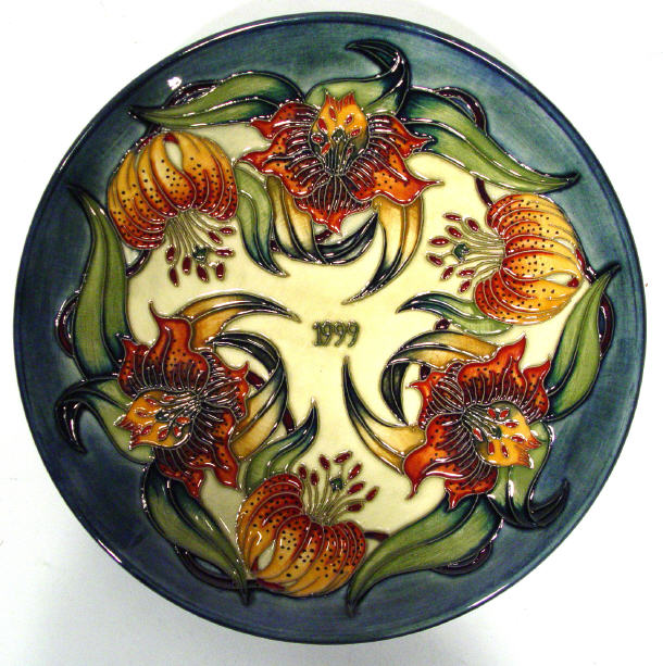 Appraisal: Moorcroft Pottery year plate hand painted with flowers onto a