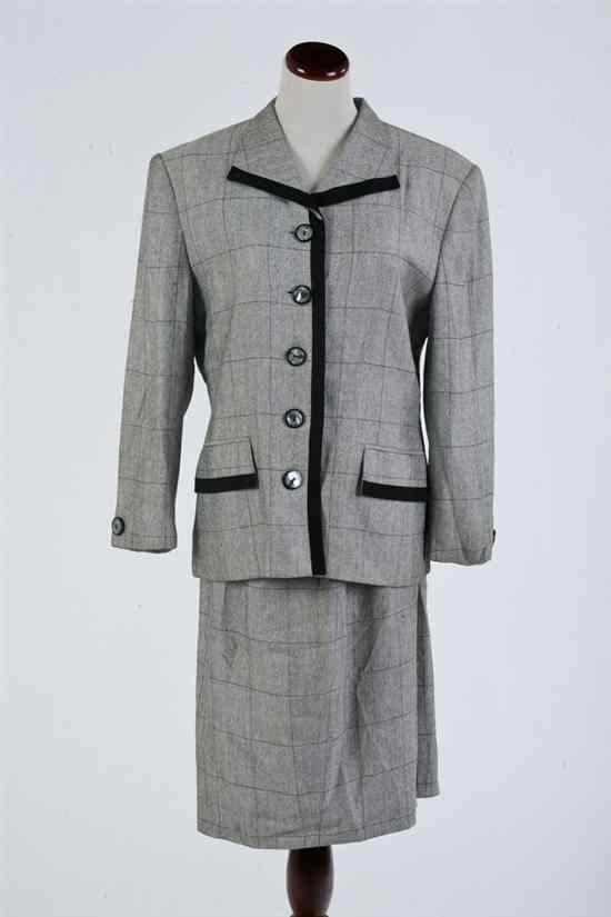 Appraisal: CHRISTIAN DIOR BLACK AND WHITE TWEED SUIT Jacket with mother-of-pearl