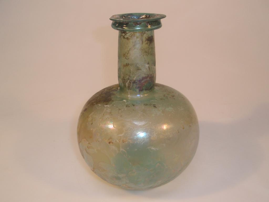 Appraisal: A large bulbous Roman bottle made in light bluish-green glass