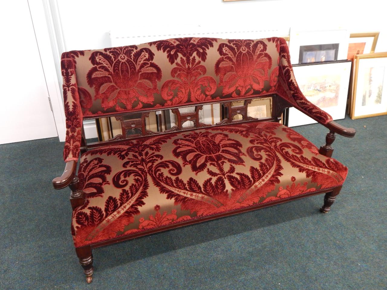 Appraisal: An Edwardian marquetry sofa upholstered in textured red and brown