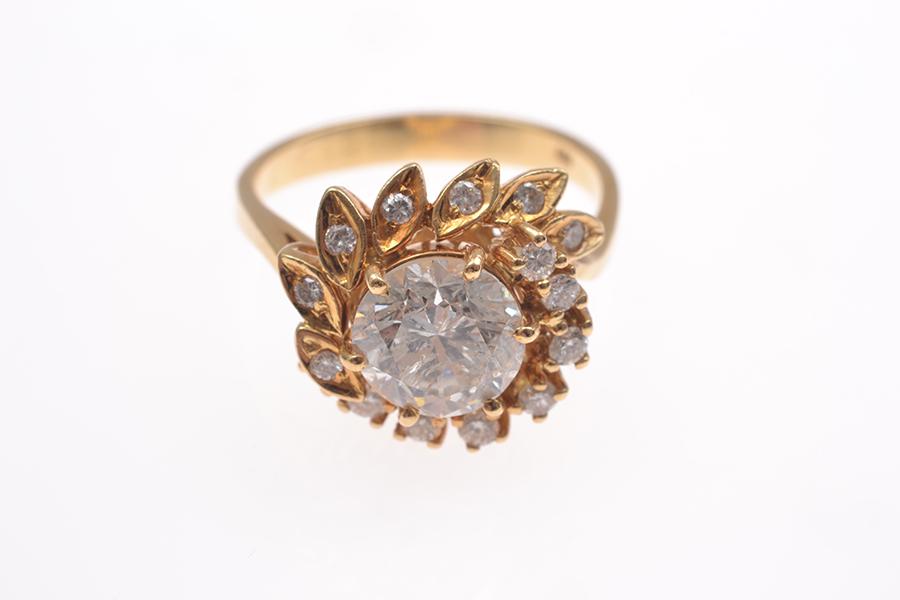 Appraisal: A DIAMOND DRESS RING FEATURING A ROUND BRILLIANT CUT DIAMOND