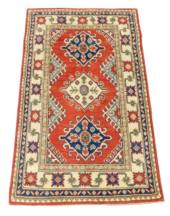 Appraisal: RUG Uzbek Kazak scatter rug three diamond cartouches on red