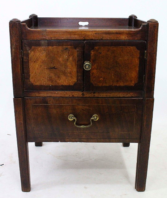 Appraisal: A GEORGIAN MAHOGANY COMMODE with galleried top cross banded cupboard