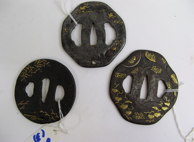 Appraisal: THREE JAPANESE TSUBA SAMURAI SWORD GUARDS in patinated iron inlaid