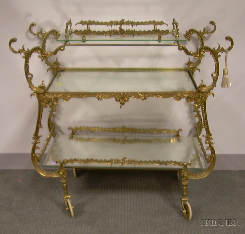 Appraisal: Rococo-style Cast Brass Three-Tiered Beverage Wagon with Mirrored and Glass