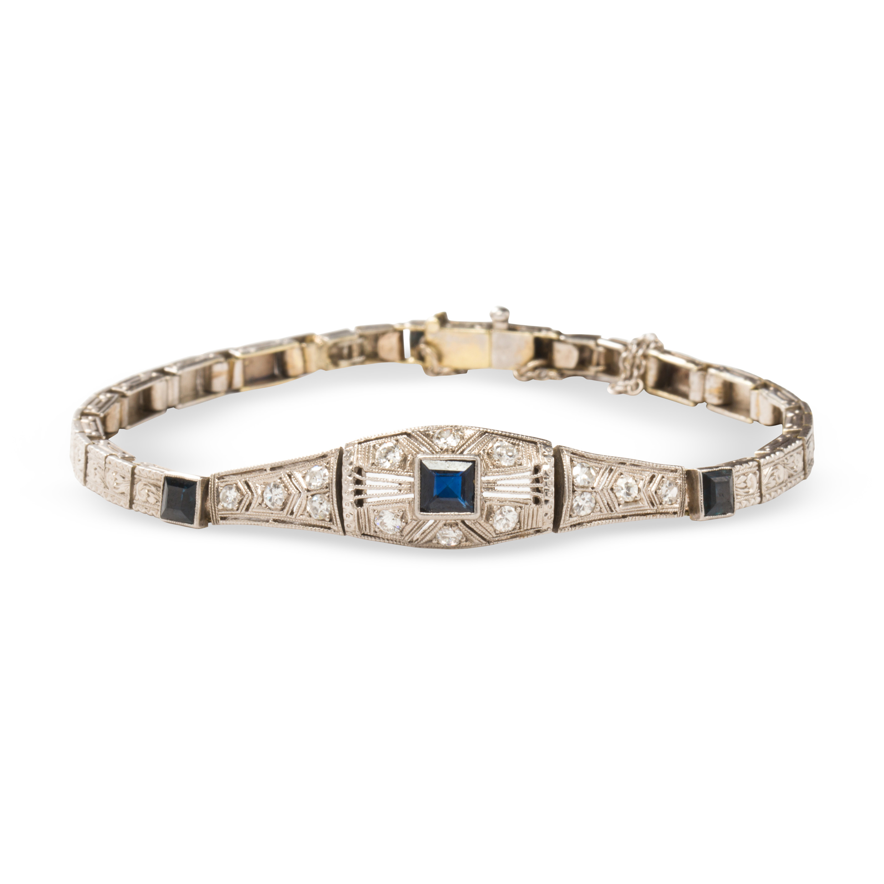 Appraisal: AN ART DECO DIAMOND SYNTHETIC SAPPHIRE AND FOURTEEN KARAT WHITE