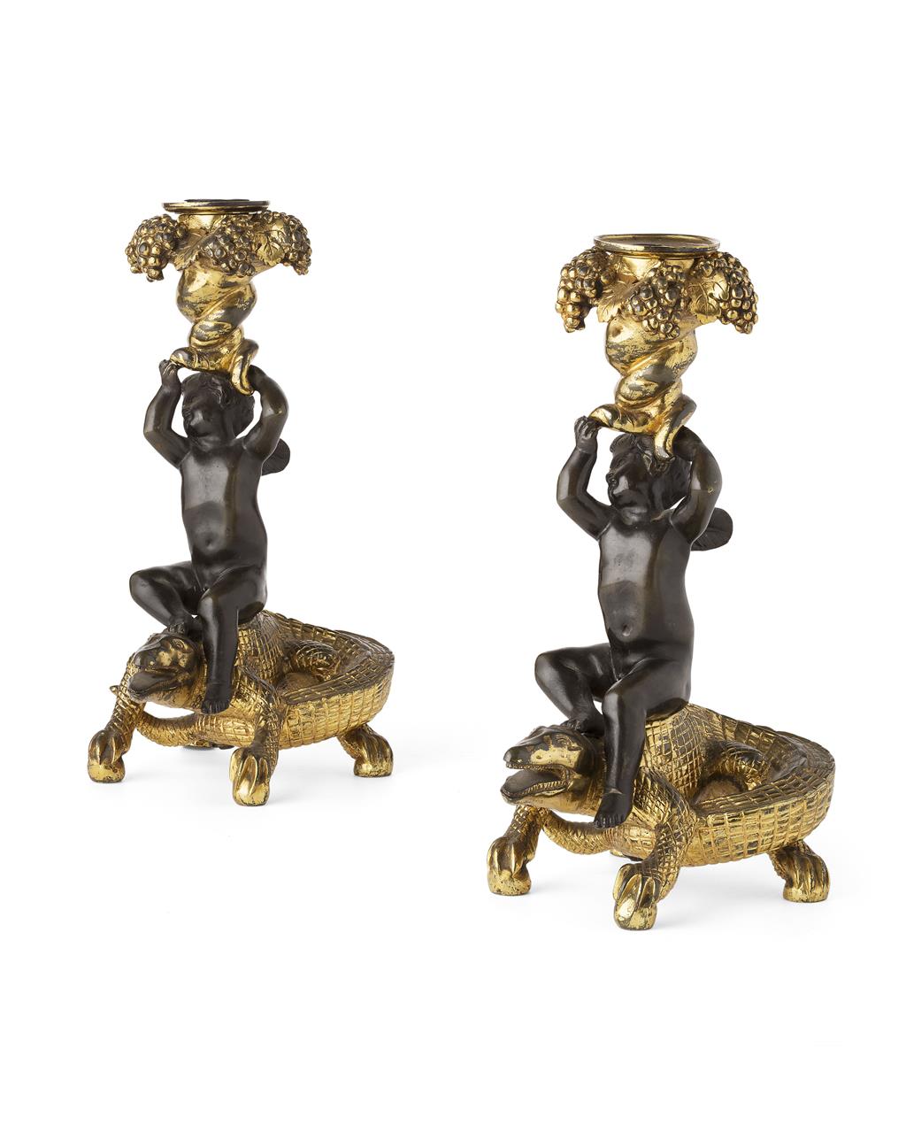 Appraisal: PAIR OF GILT AND PATINATED BRONZE FIGURAL CANDLESTICKS TH CENTURY