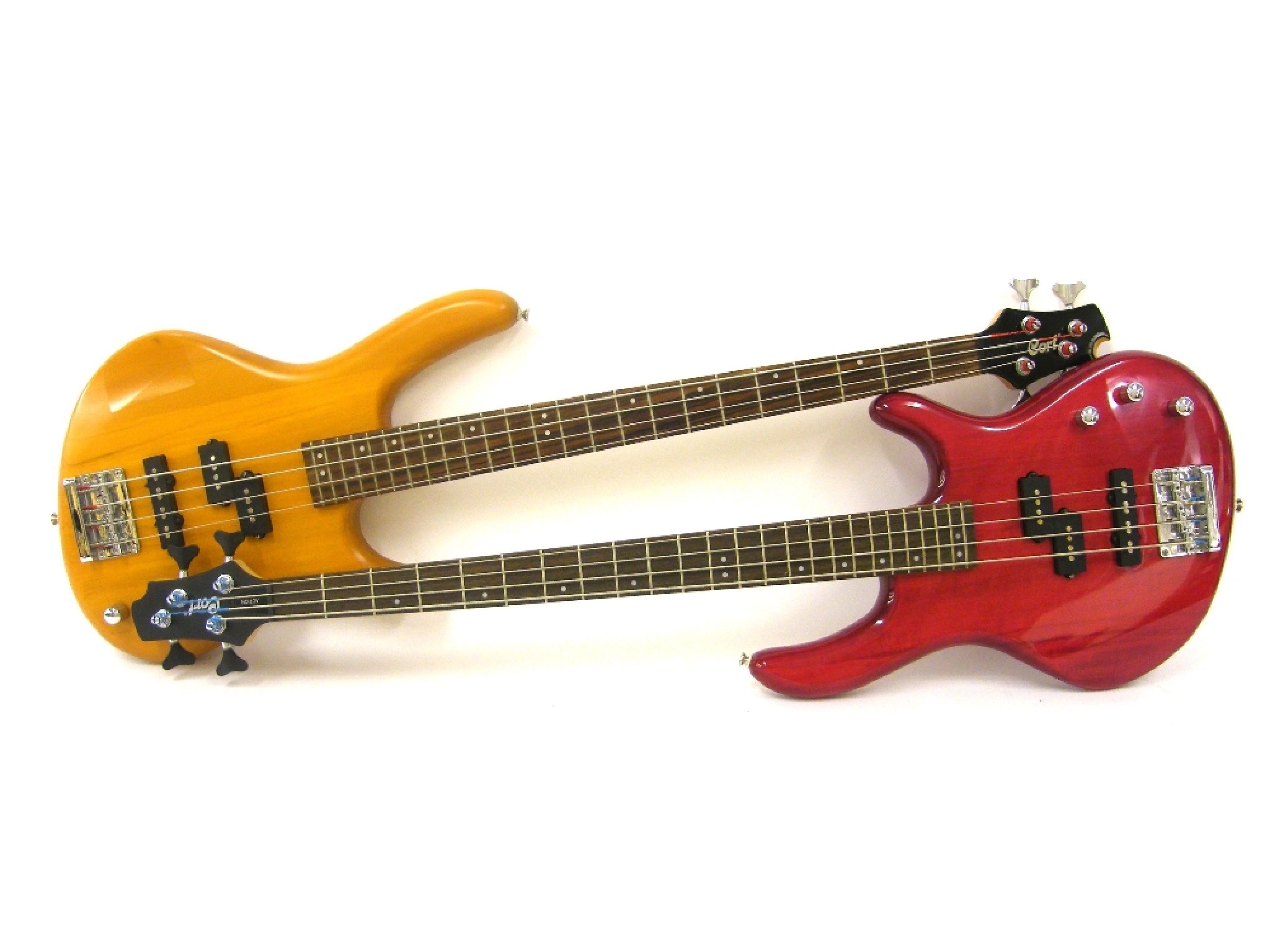 Appraisal: Two Cort Action bass guitars one with red finish one